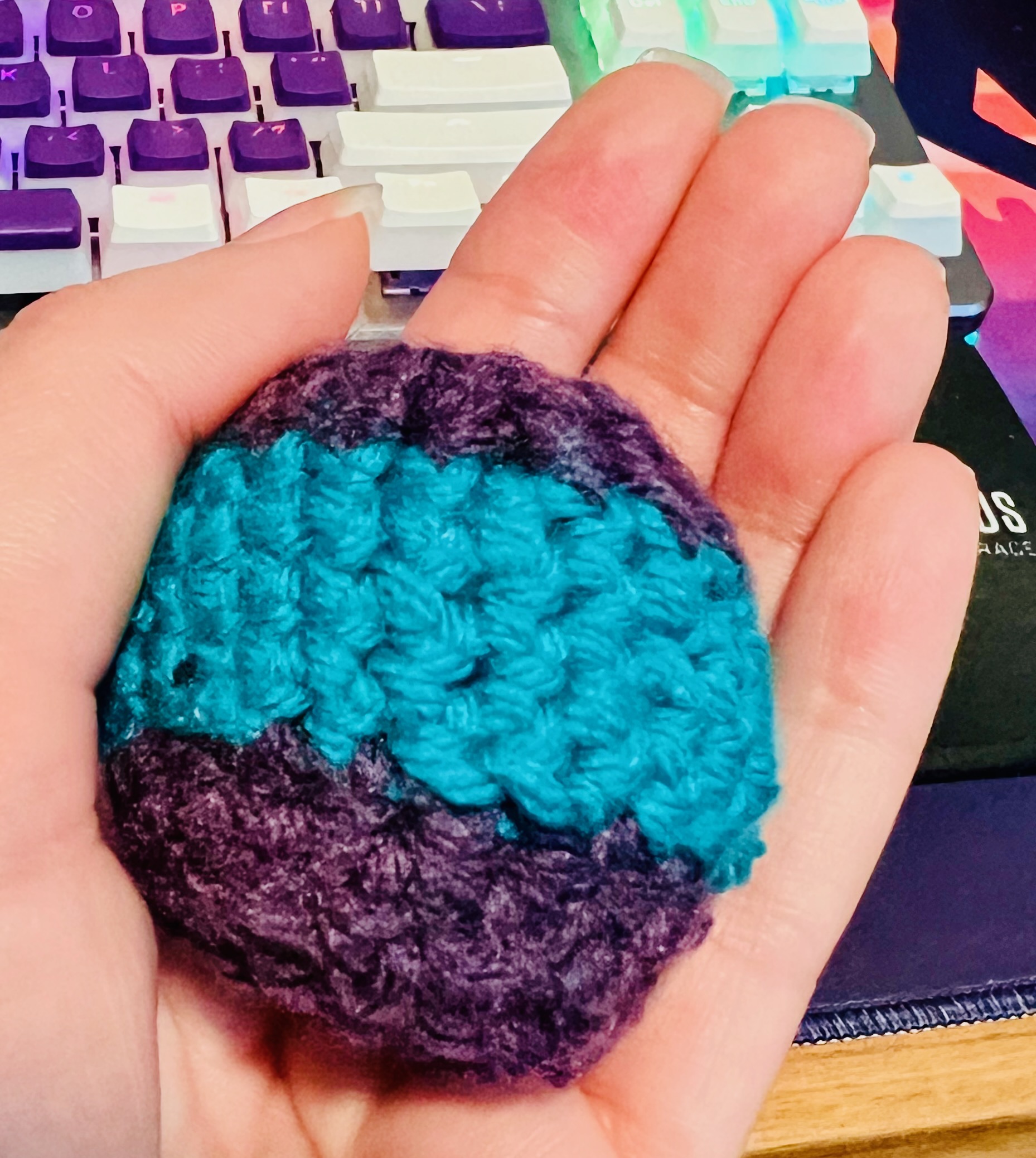 a blue and purple crochet hacky sack